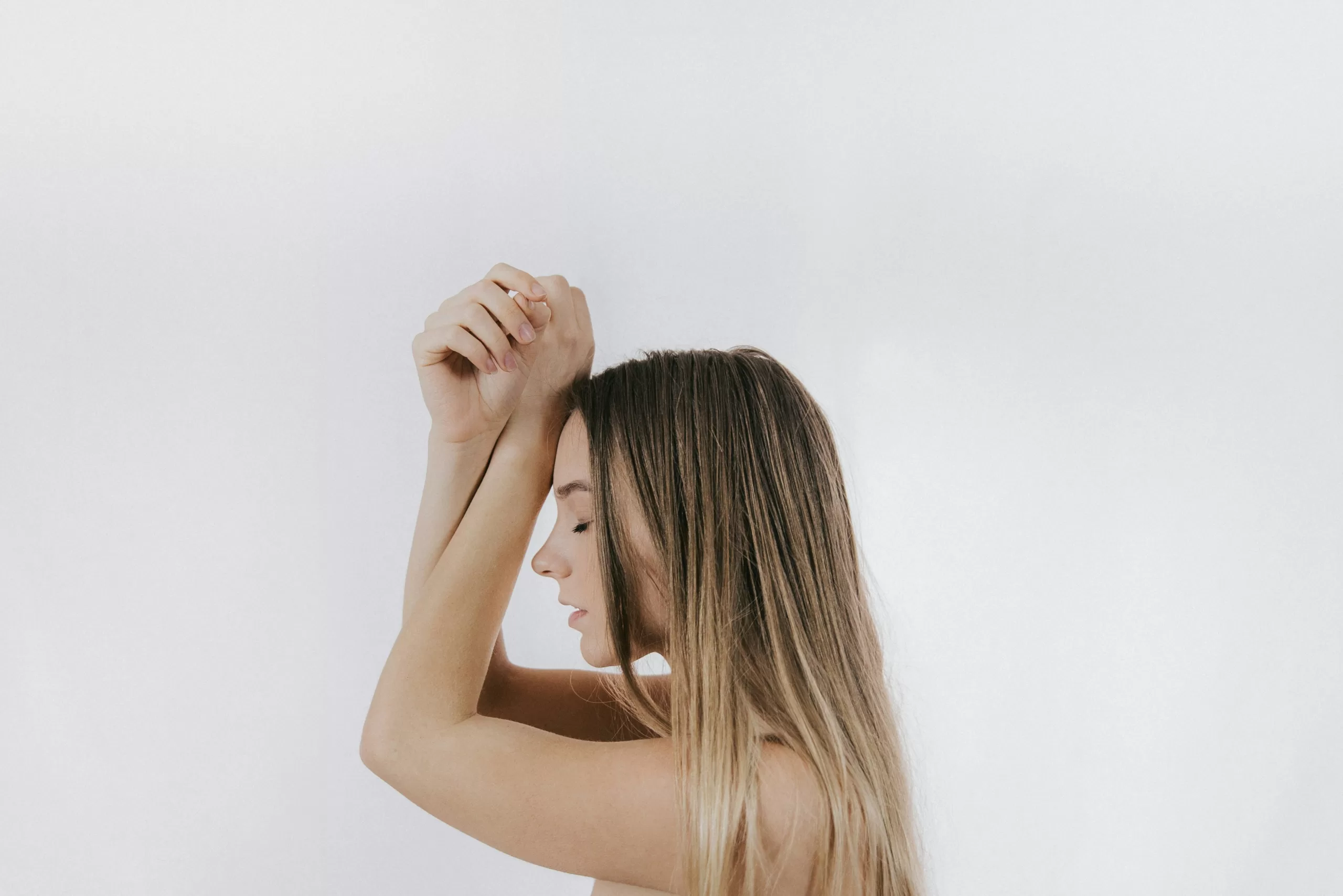 Woman meditating to reduce stress and support hormonal balance