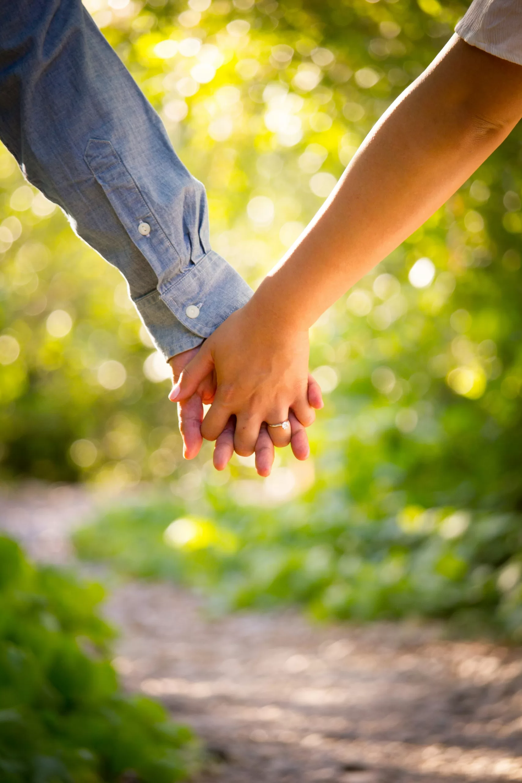 Couple holding hands, symbolizing support, connection, and holistic fertility wellness.