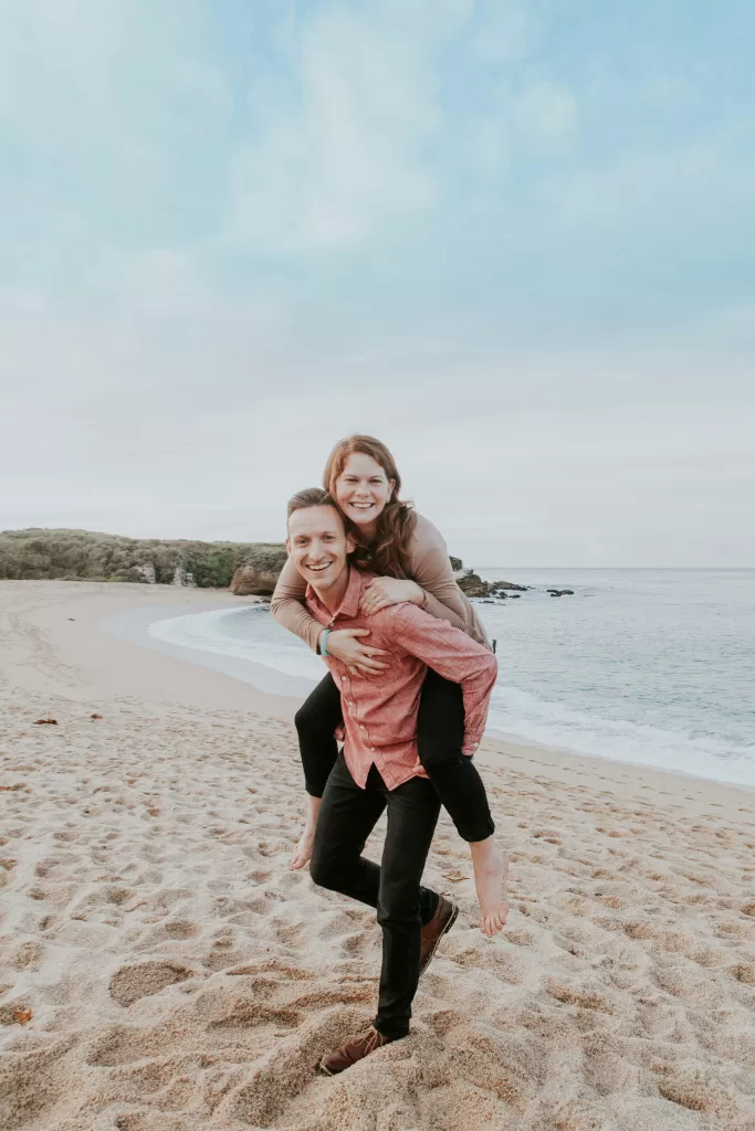 A happy couple embracing outdoors, radiating warmth and connection.