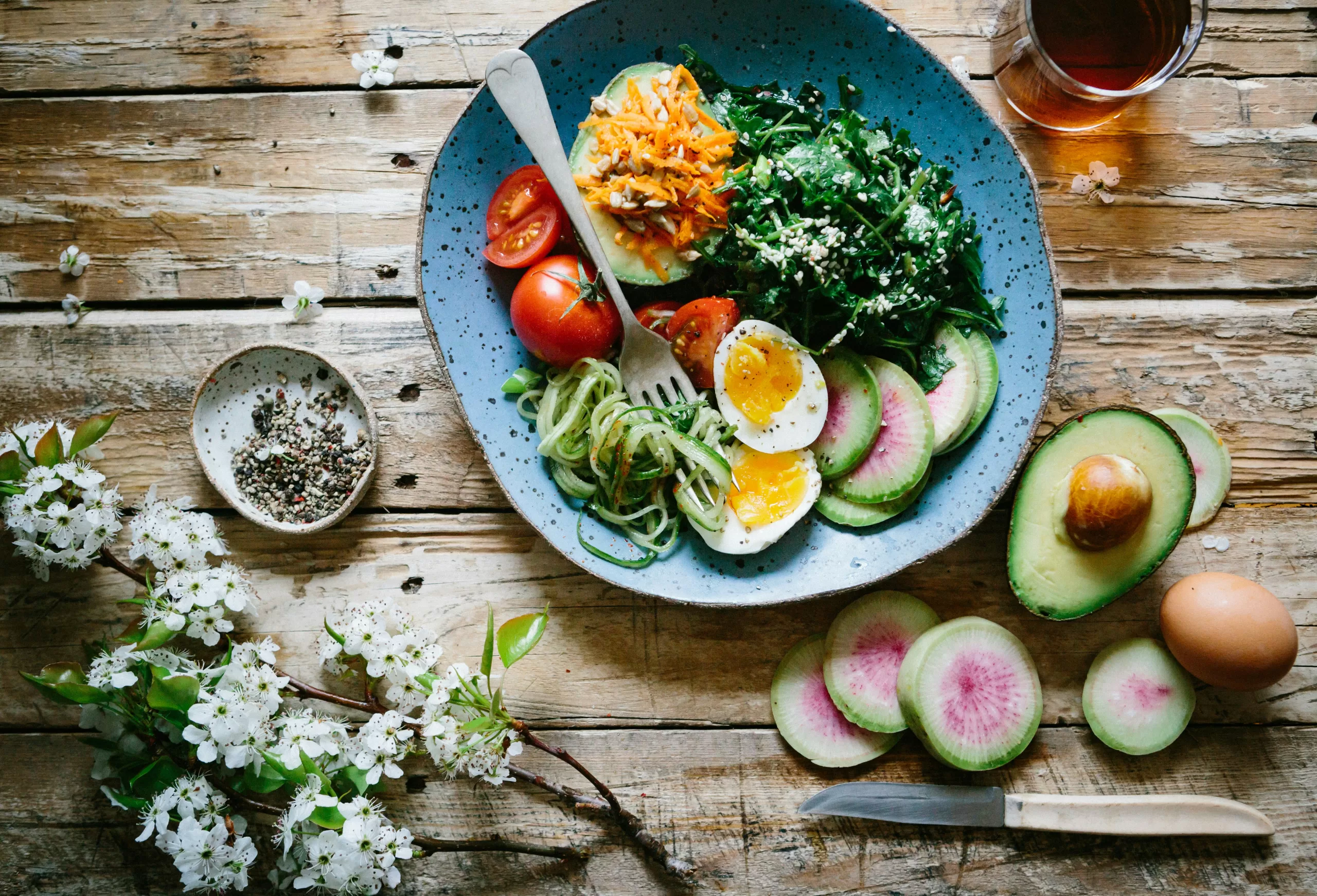 A plate of colorful, nutrient-dense food used in dietary therapy as part of integrative Chinese medicine to support overall health and balance.