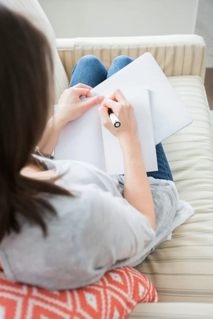 Woman journaling as part of her detox and weight loss program at Awaken and Bloom in Salt Lake City